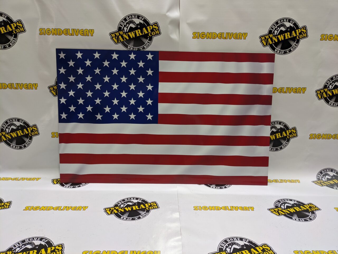printed american flag sign on metal